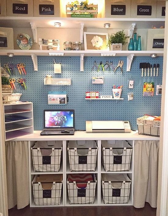 a blue pegboard and several shelves with storage containers for a neat look