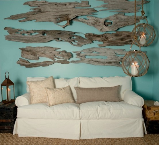 a driftwood art on the wall over the sofa plus jute and burlap for a coastal home