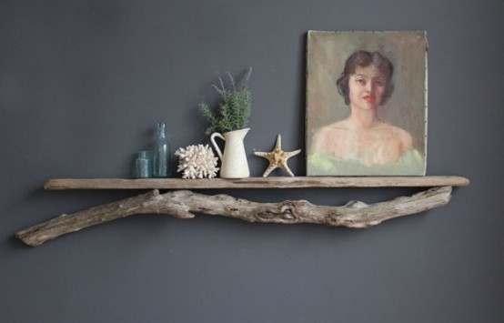a shelf with driftwood under it brings a slight beachy feel to the space