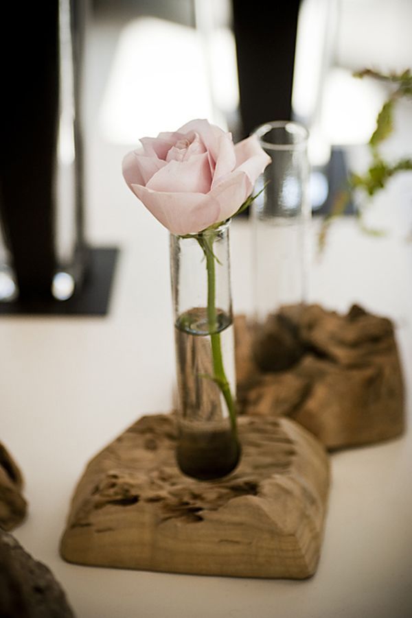 driftwood stands with little vases and blooms for chic home decor