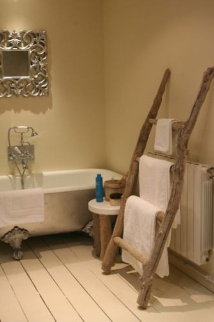 a ladder of driftwood used to hang towels