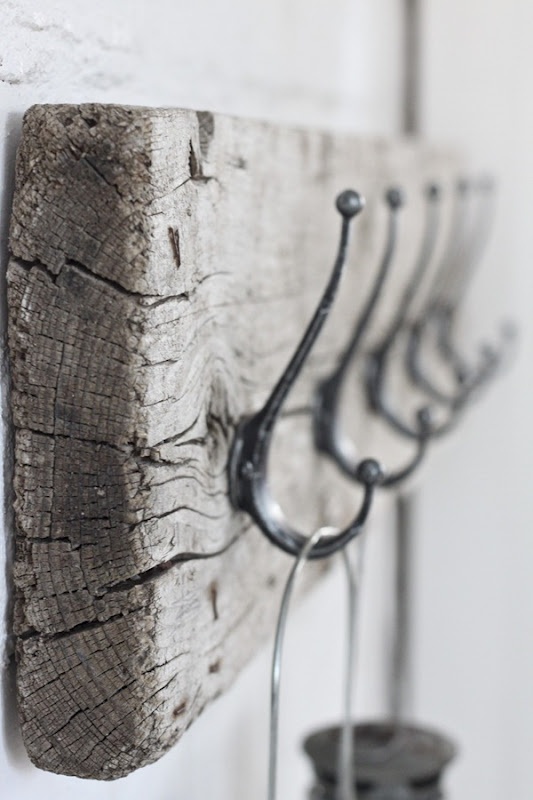 a driftwood rack with hooks will bring a coastal feel to your entryway