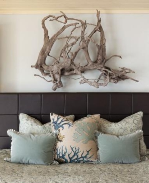 a driftwood artwork over the bed is a stylish idea for a contemporary beach bedroom