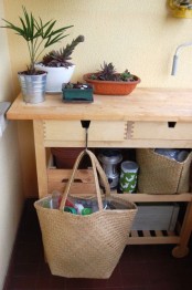 an IKEA Forhoja cart used for planting and garden works – it has enough storage space, drawers and open spaces