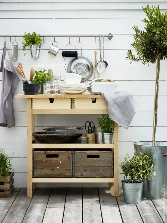an Ikea Forhoja cart used for outdoors - for storing tableware, pots, planters, drinks and other stuff as a normal cart