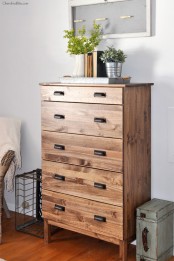 a dark stained IKEA Tarva dresser with vintage metal handles will bring a rustic feel to the space