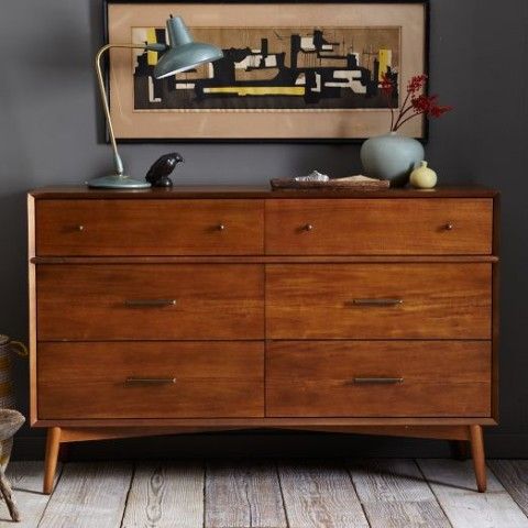A rich stained Tarva hack with knobs and handles on legs is ideal for a mid century modern wedding