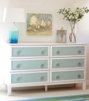 a vintage Tarva hack painted white, with blue drawers and vintage ring pulls for a vintage space