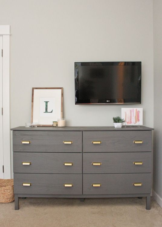 A grey Tarva hack with brass retro inspired pulls is a classic and chic storage item