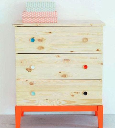 bright orange legs and a frame plus colorful knobs make this Tarva dresser bold and fun