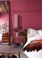 a fuchsia brick wall is a unique idea that will give a character and a unique look to the bedroom