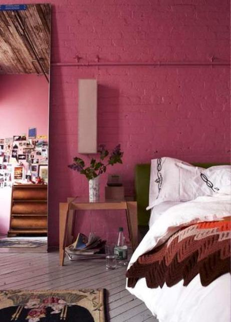 a fuchsia brick wall is a unique idea that will give a character and a unique look to the bedroom
