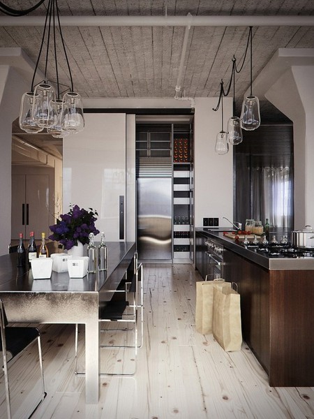 Metal surfaces and industrial pendant lights with long black cords looks great together.