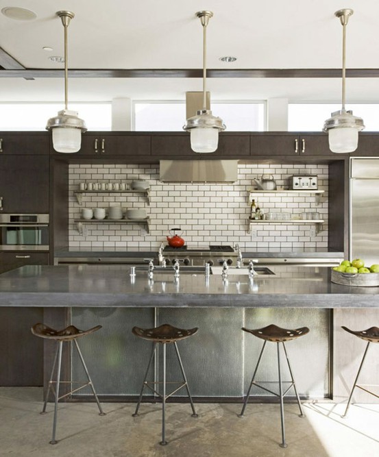 Modern take on industrial style kitchen design where metal surfaces are stainless steel. It's really practical.