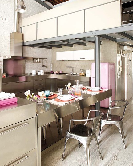 Who said a industrial kitchen can't feature colorful appliances? A pink SMEG fridge looks amazing on this one.