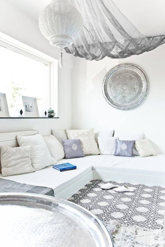 This airy living space is definitely perfect for a cozy weekend, surrounded by lots of throw pillows.