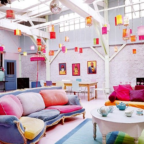 Be adventurous with textures and colors. Just check out how good colorful hanging lights and throw pillows looks surrounded by totally white brick walls.