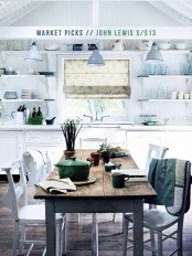 green tableware, fresh greenery and a green blanket make the kitchen fresher and brighter