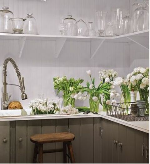Refresh your kitchen with lots of fresh white tulips to make it look spring like, cool and bright