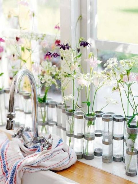 Test tubes with lots of wildflowers and bold blooms are a cool spring like decoration
