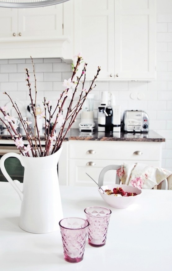fresh cherry blossom in a jug will refresh your tablescape a lot and will make it look spring-like