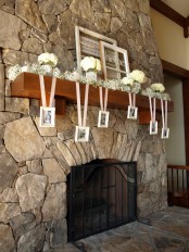 baby’s breath, hydrangea arrangements in glasses and hanging photos of the whole family