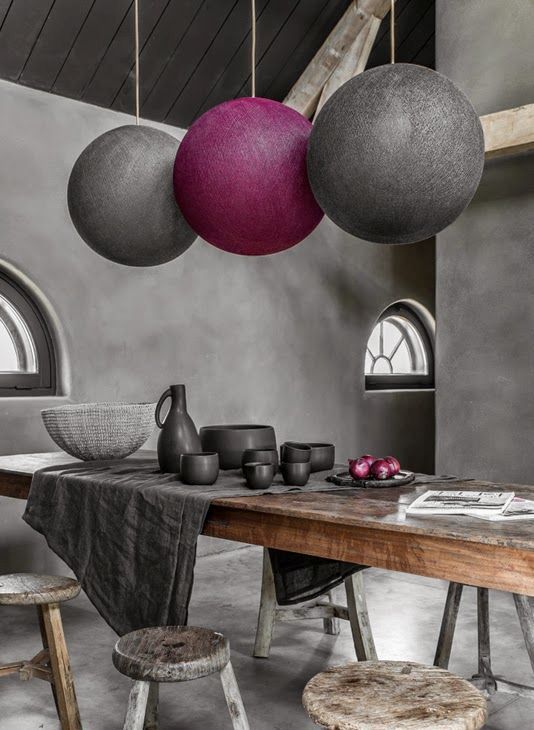rough concrete walls, a rough wooden table and stools will make your dining space cooler