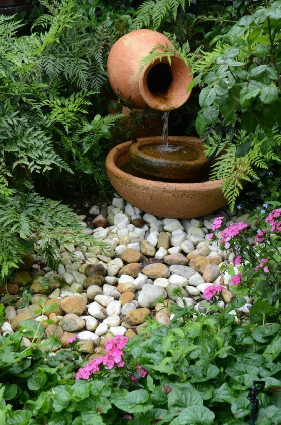 a small and delicate fountain of a porcelain vase and bowls is a lovely idea for a small garden - you get a fountain that doesn't take much space