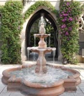 a large tiered stone fountain is a very elegant and chic space, it will give that refined Spanish colonial feel to the garden