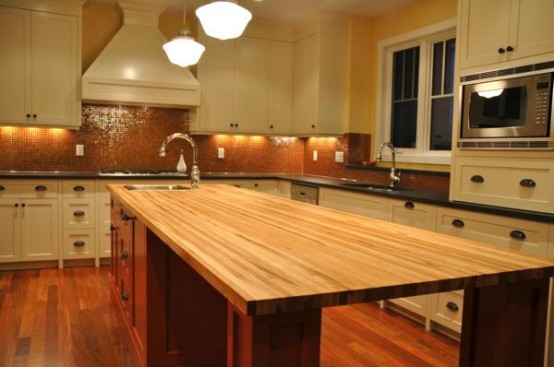 A butcher block island is a quite stylish solution for traditional kitchens.