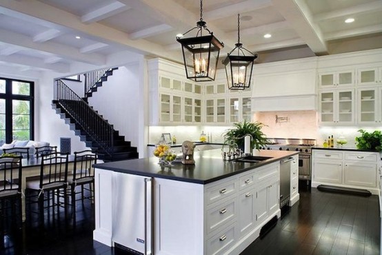 Black stone countertop with white cabinets is a more practical solution for a black kitchen.