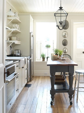 This is a really smart solution for any kitchen. A vintage looking tall table on casters. It can easily moved anywhere you like. You can use it as an additional dining surface or as for food  prep.