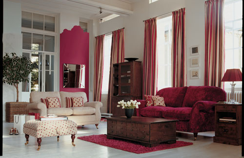 Living Room With Deep Reds Complementing Brown Furniture