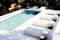private long plunge outdoor pool with a white deck