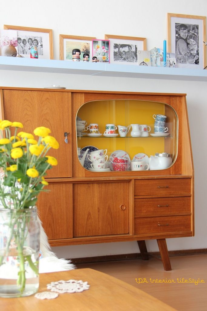 A light stained mid century modern buffet with drawers, usual storage compartments and glass enclosed parts is a very stylish and cool idea for a modern space