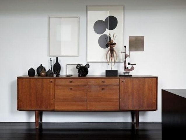 A stained credenza with drawers and tall legs is a cool idea for a mid century modern or Scandinavian space with a touch of chic
