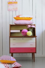 a pretty ombre mid-century modern cabinet with colorful drawers is a lovely idea for a modern space with a touch of color