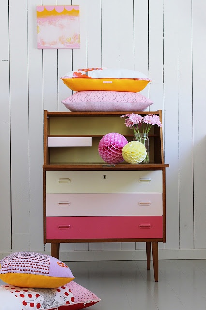 a pretty ombre mid-century modern cabinet with colorful drawers is a lovely idea for a modern space with a touch of color