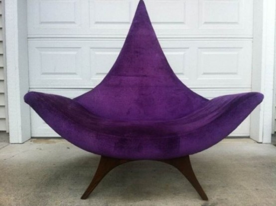 a bold and catchy purple mid-century modern chair with a pointed back and tall legs, with armrests is a stylish idea for adding color and a sharp touch with its design