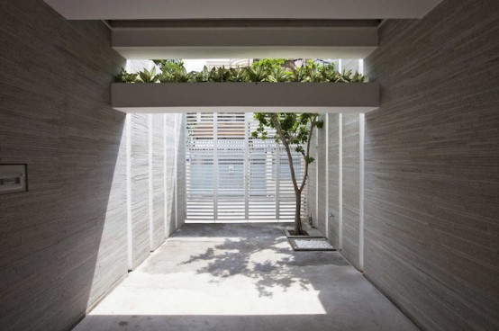 Minimalist Concrete House With A Large Vertical Garden