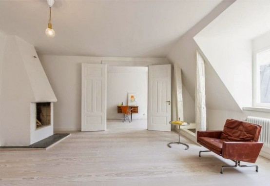 Minimalist Stockholm Apartment Designed With Bright Orange Accents