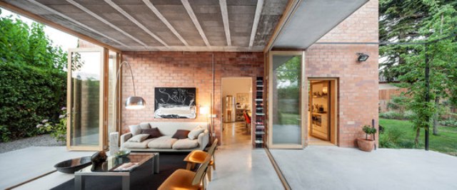 Modenr brick home that merges with the garden  1