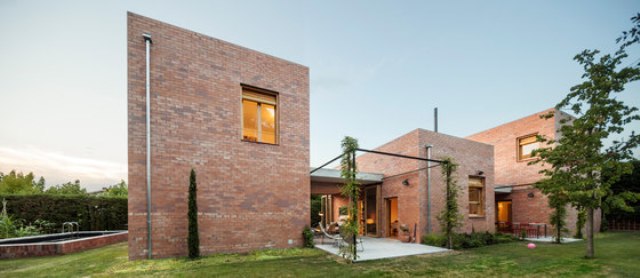 Modenr brick home that merges with the garden  12