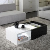 a modern black and white storage coffee table that can be opened or closed is a cool idea for a small and laconic in design space