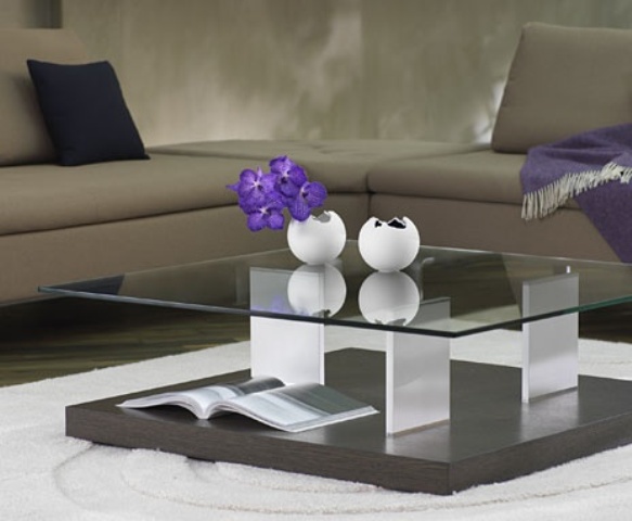 A creative modern coffee table with two tabletops   a plywood and a glass one plus clear legs