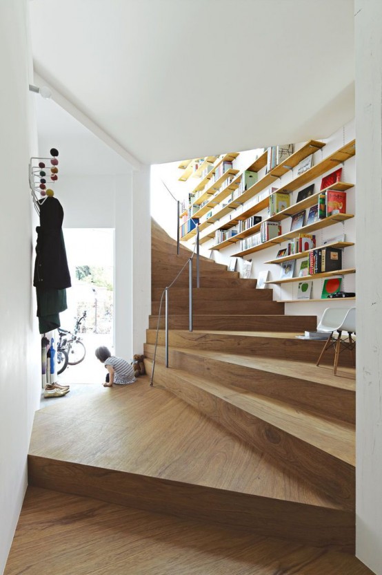 neutral floating bookshelves on the wall over the staircase won't take some spearate space and you can read sitting on the steps