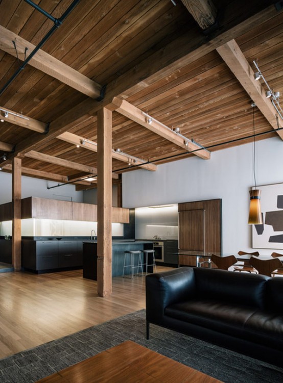 Modern Loft Renovation With Lots Of Wood In The Decor