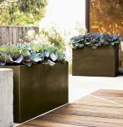 black porcelain planters will give an edgy feel to your outdoors and will make a statement with their color