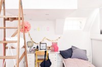 a two level girl’s bedroom with a loft bedroom and a bed and a desk on the lower level plus a staircase