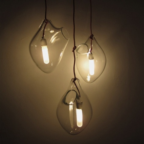 original glass pendant lamps of irregular shapes, bulbs inside are a unique idea, with a fresh take on the traditional pendant lamps